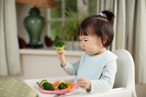 Children are eating vegetables as nutrients in growth