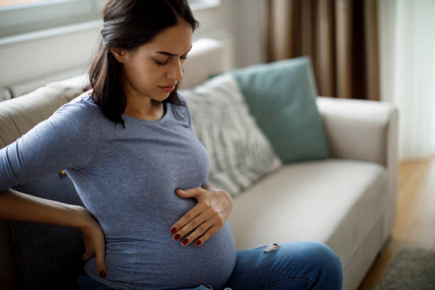 Pregnant women are in pain in their stomachs. 